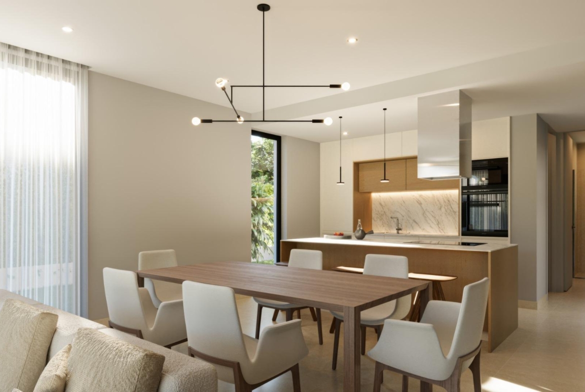 Bright modern open-plan dining and kitchen area in exclusive 3-bedroom villa at Sierra Cortina, Finestrat with elegant finishes.
