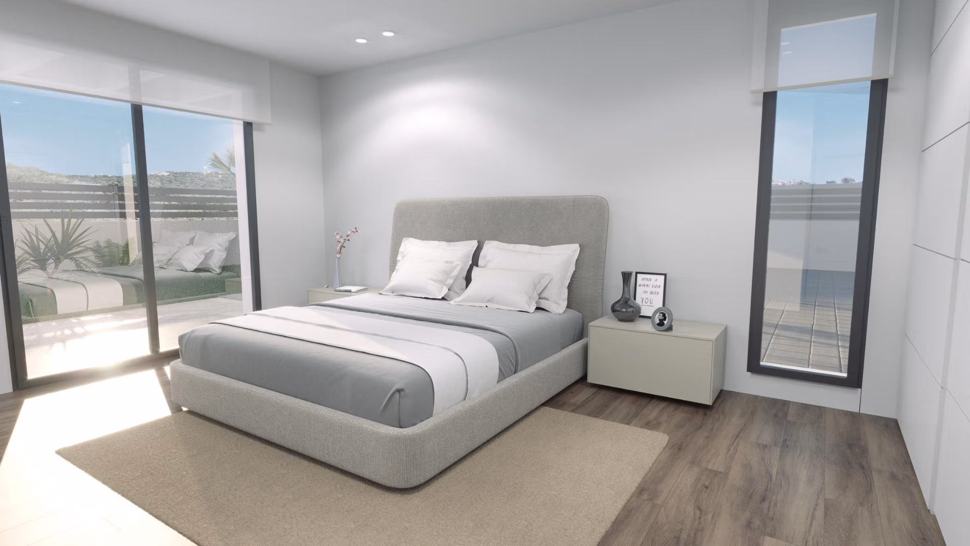 Bright, modern bedroom with minimalist décor and large windows overlooking the sunlit terrace of a new build 3-bedroom villa in Finestrat.