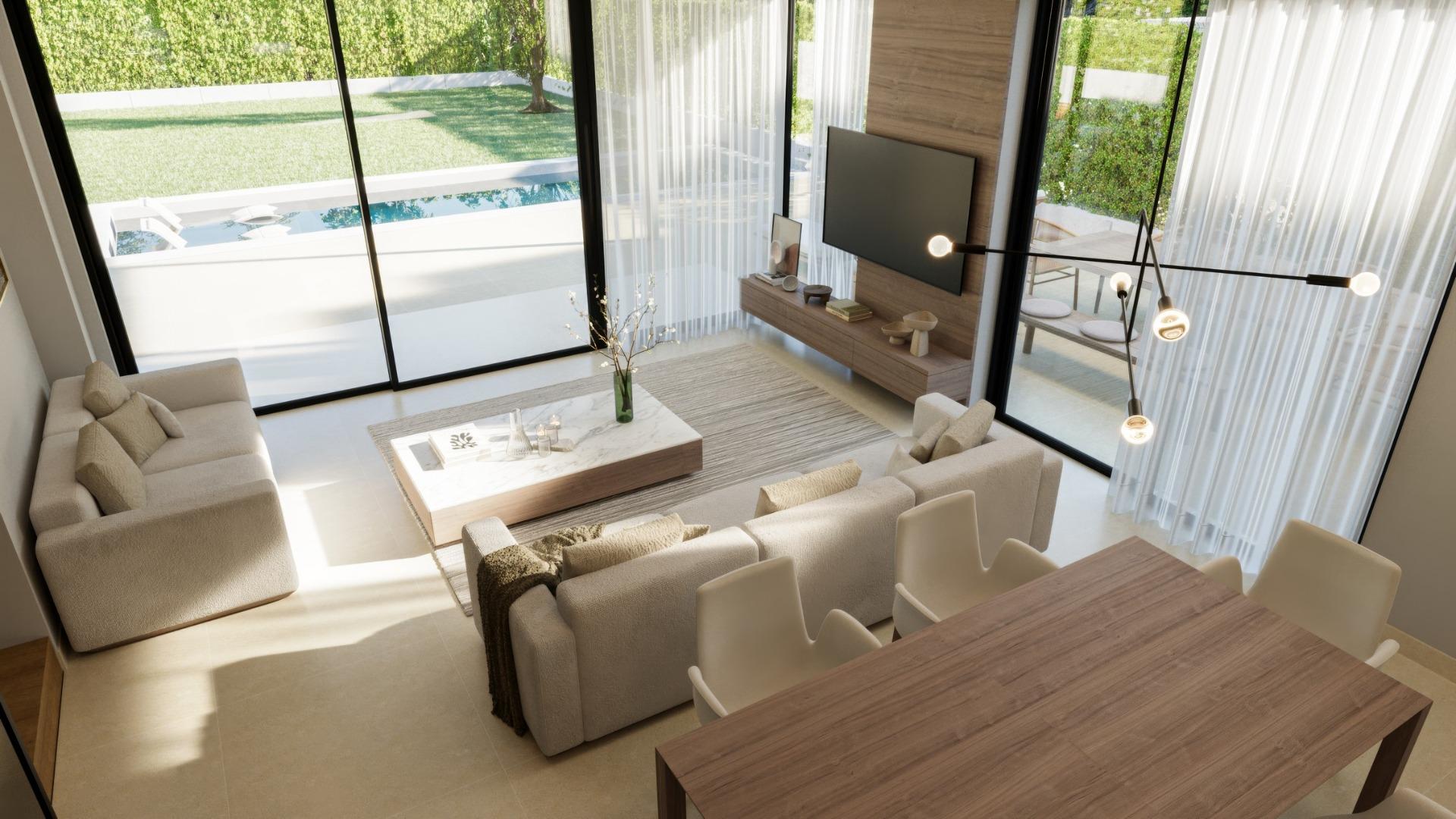 Bright, modern living and dining area in a luxury 3-bedroom villa with floor-to-ceiling windows overlooking the private pool in Sierra Cortina, Finestrat.