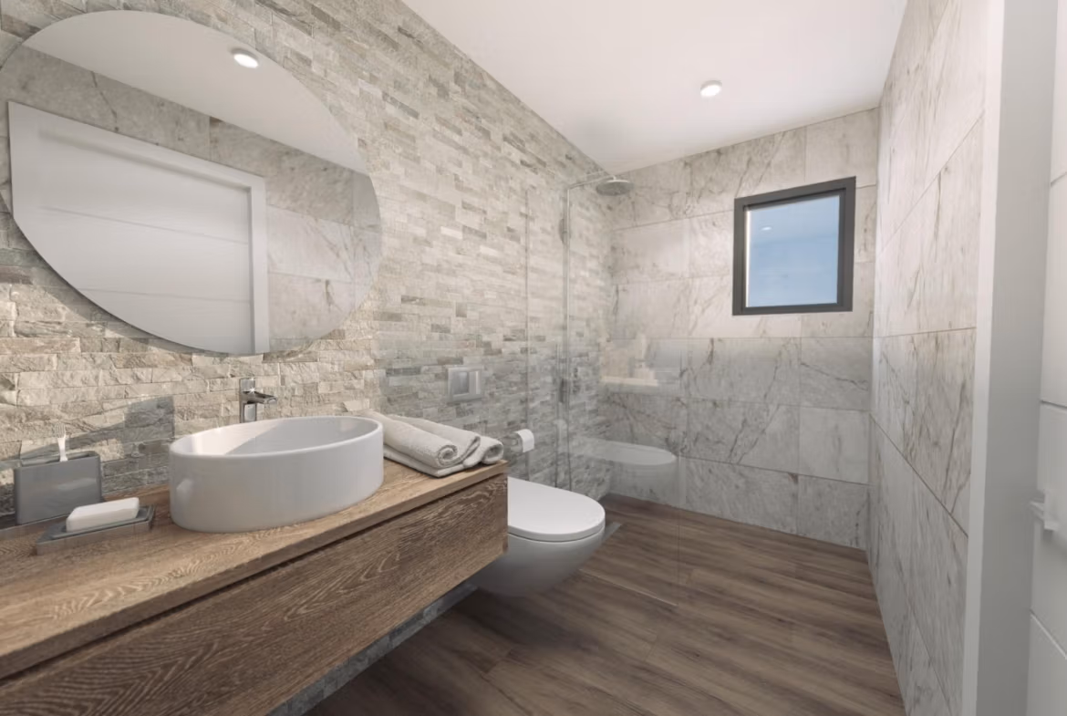 Modern, elegant bathroom with stone tile walls and wood-effect flooring in a new build 3-bedroom villa in Finestrat.