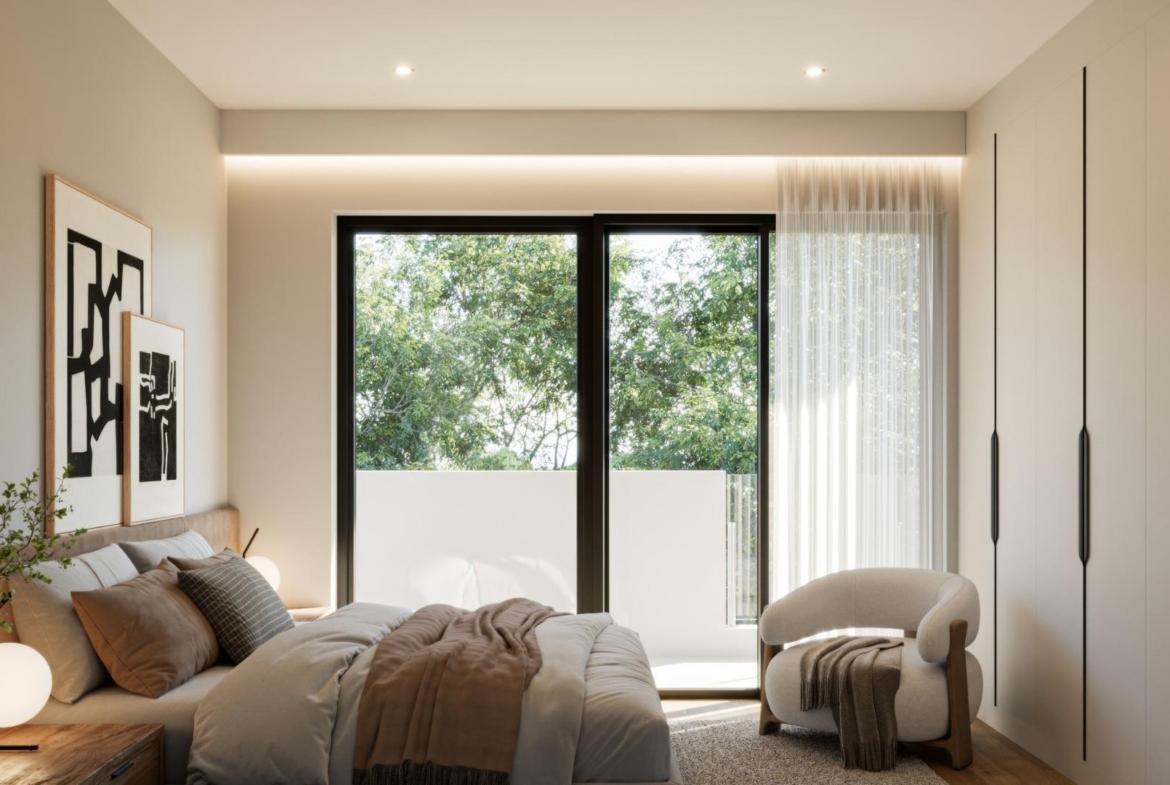 Bright and elegant bedroom in a new 3-bedroom villa in Sierra Cortina, Finestrat with minimalist design and serene garden views