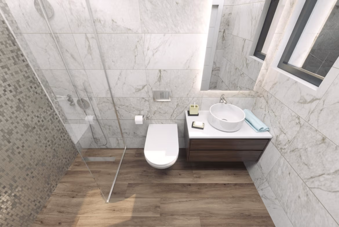 Modern, elegant bathroom with marble walls and walk-in shower in a new build 3-bedroom villa in Finestrat.