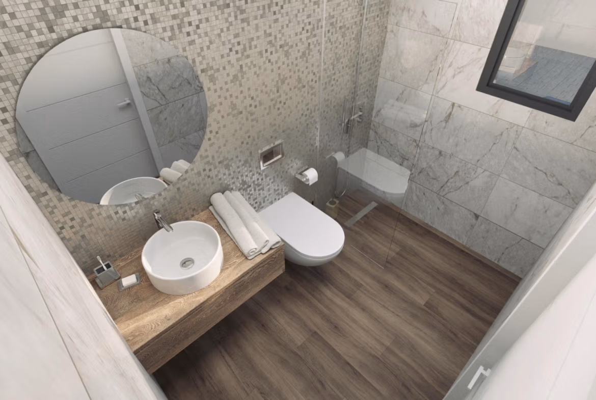 Modern, elegant bathroom with marble walls and wood-effect flooring in a new build 3 bedroom villa in Finestrat.