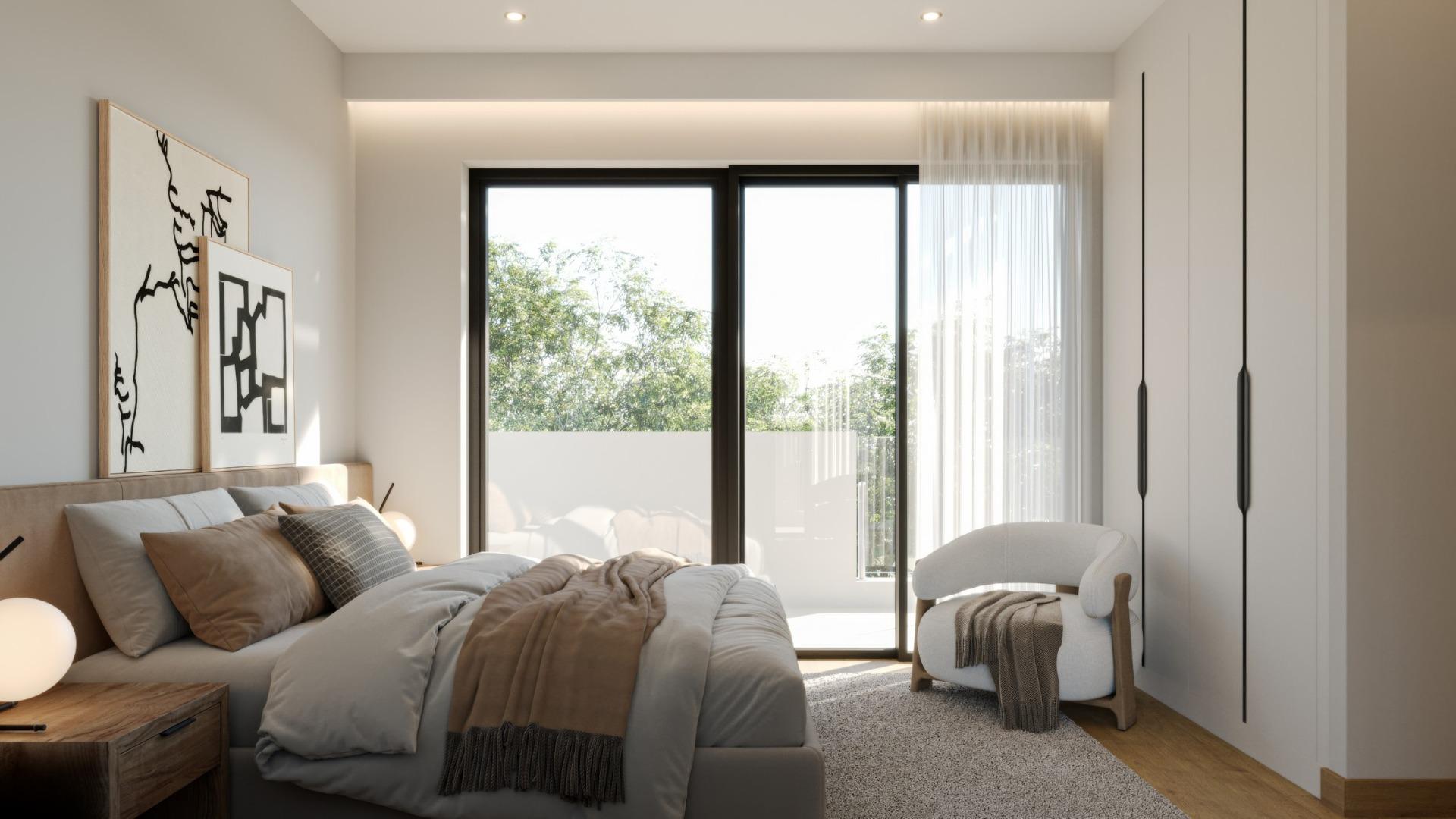 Bright and elegant 3-bedroom villa bedroom with floor-to-ceiling windows and natural views in Sierra Cortina, Finestrat.