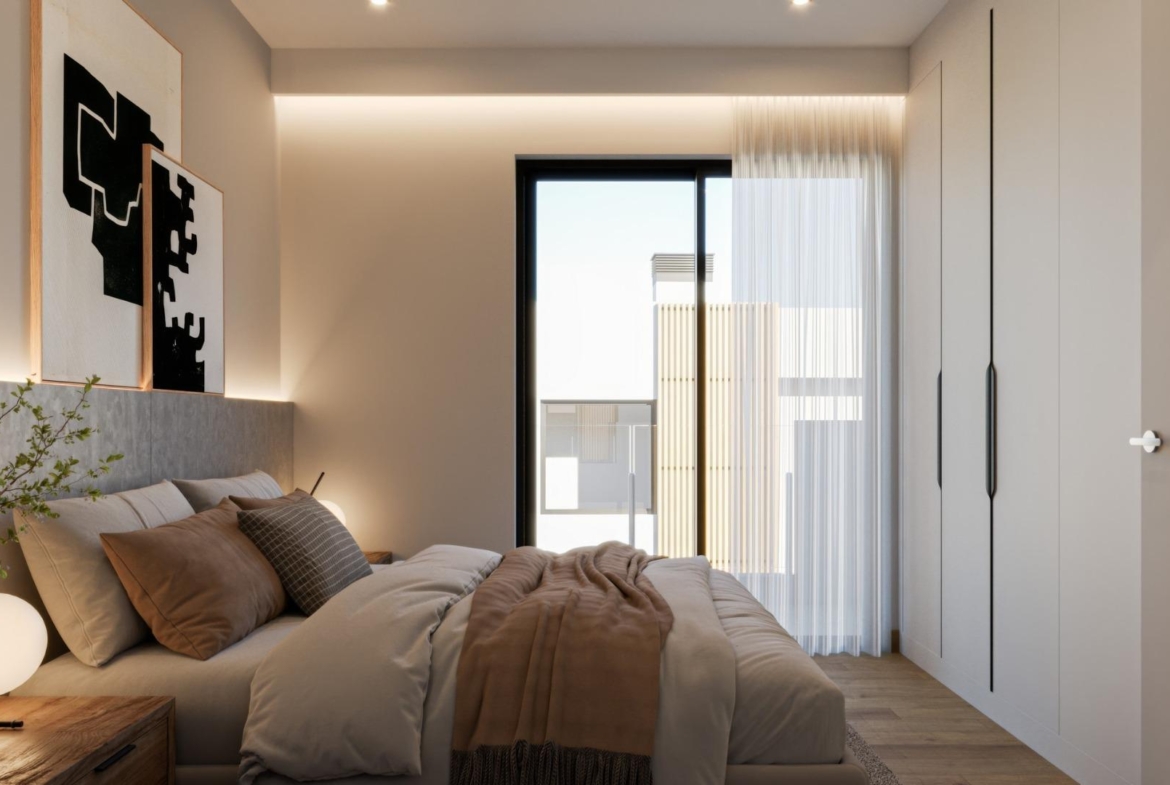 Bright, elegant bedroom with modern furnishings and soft lighting in a new 3-bedroom villa in Sierra Cortina, Finestrat.