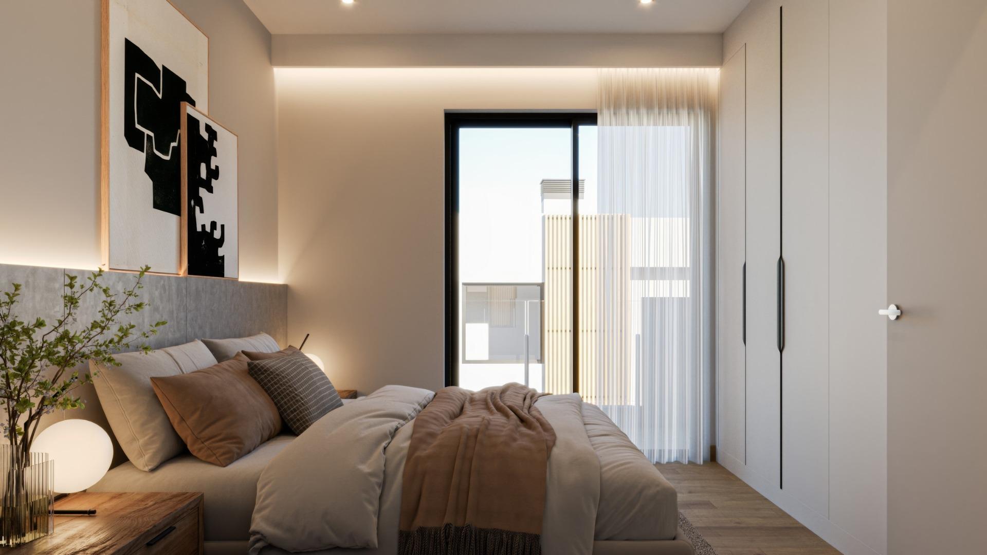 Bright, elegant bedroom with modern furnishings and soft lighting in a new 3-bedroom villa in Sierra Cortina, Finestrat.