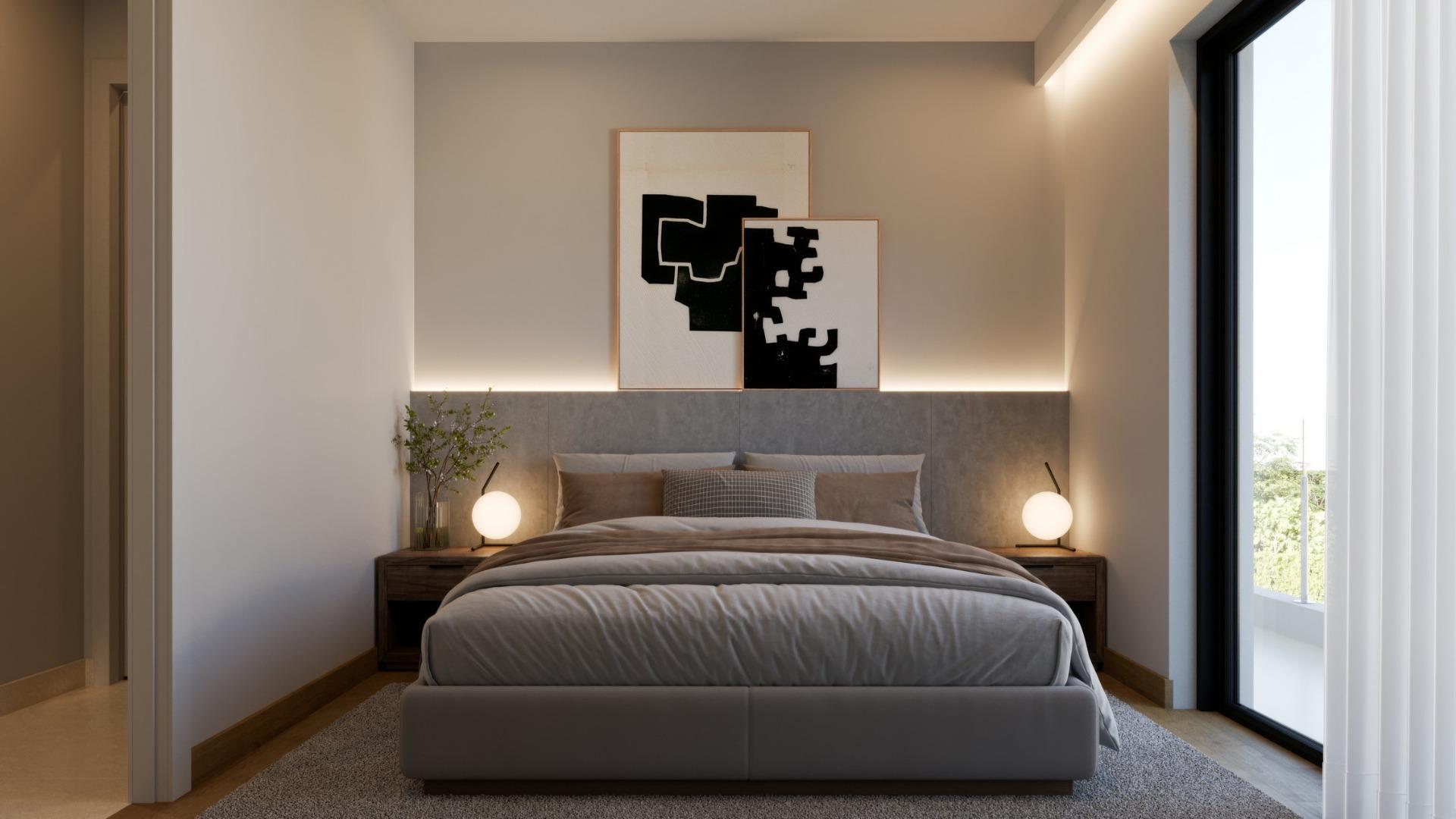 Elegant, serene bedroom in luxury 3-bedroom villa with soft lighting and sea views in exclusive Sierra Cortina, Finestrat.