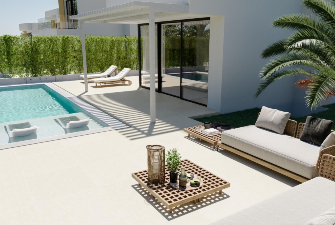 Sun-drenched terrace with private pool and stylish outdoor seating at exclusive new build 3-bedroom villa in Sierra Cortina, Finestrat.
