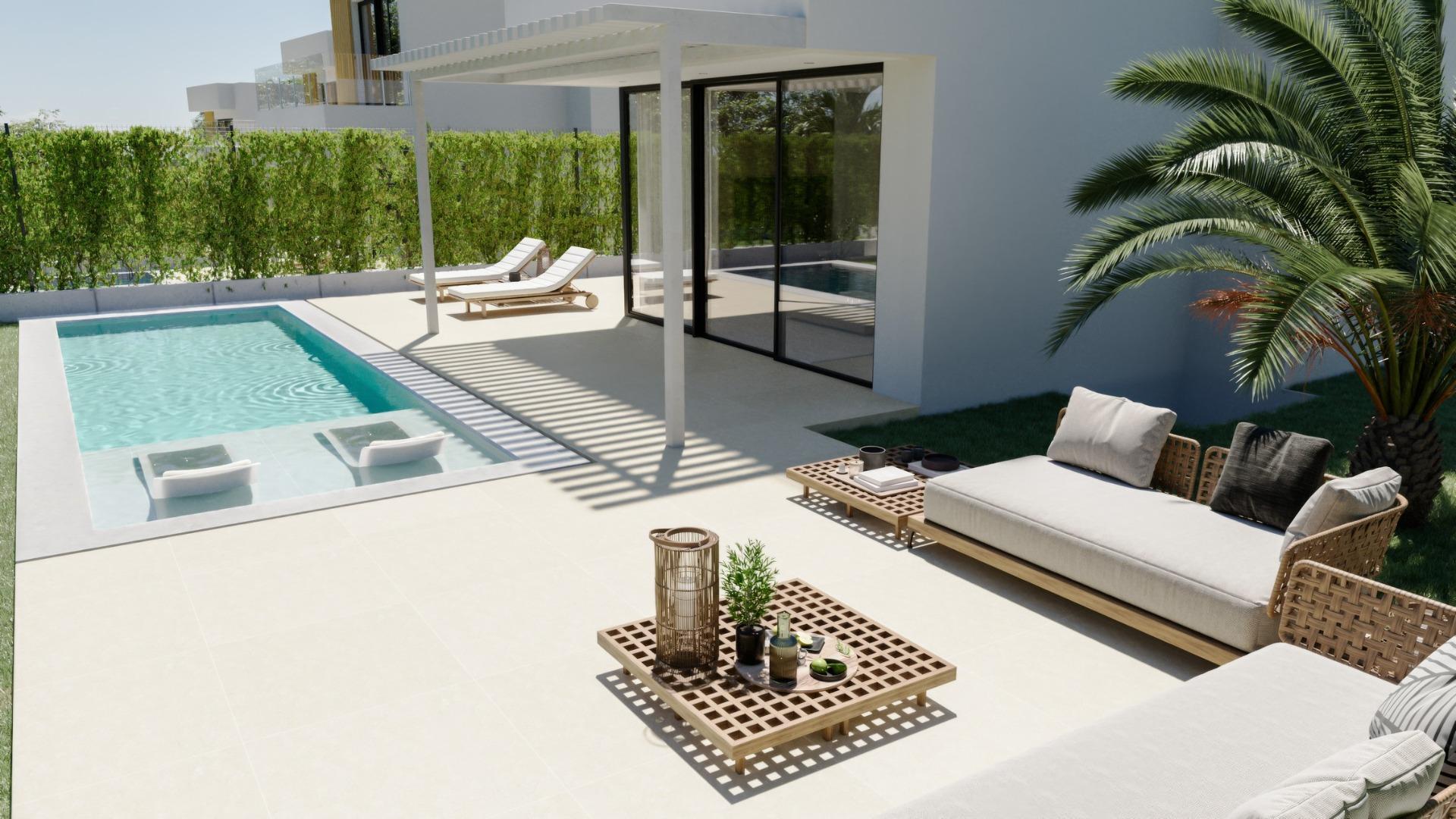 Sun-drenched terrace with private pool and stylish outdoor seating at exclusive new build 3-bedroom villa in Sierra Cortina, Finestrat.