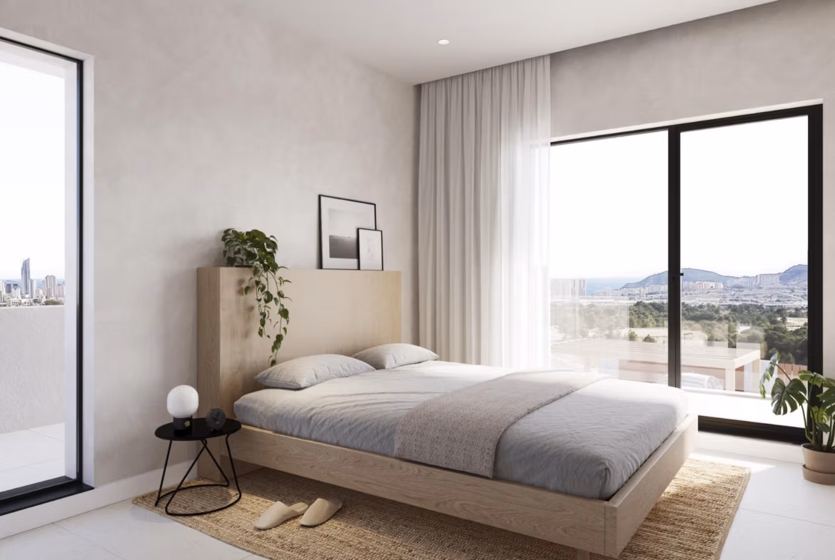 NEW-BUILD-VILLAS-IN-FINESTRAT-5 Bright, modern bedroom in luxury Key Ready Villa in Finestrat, Benidorm, featuring panoramic sea views and minimalist design.