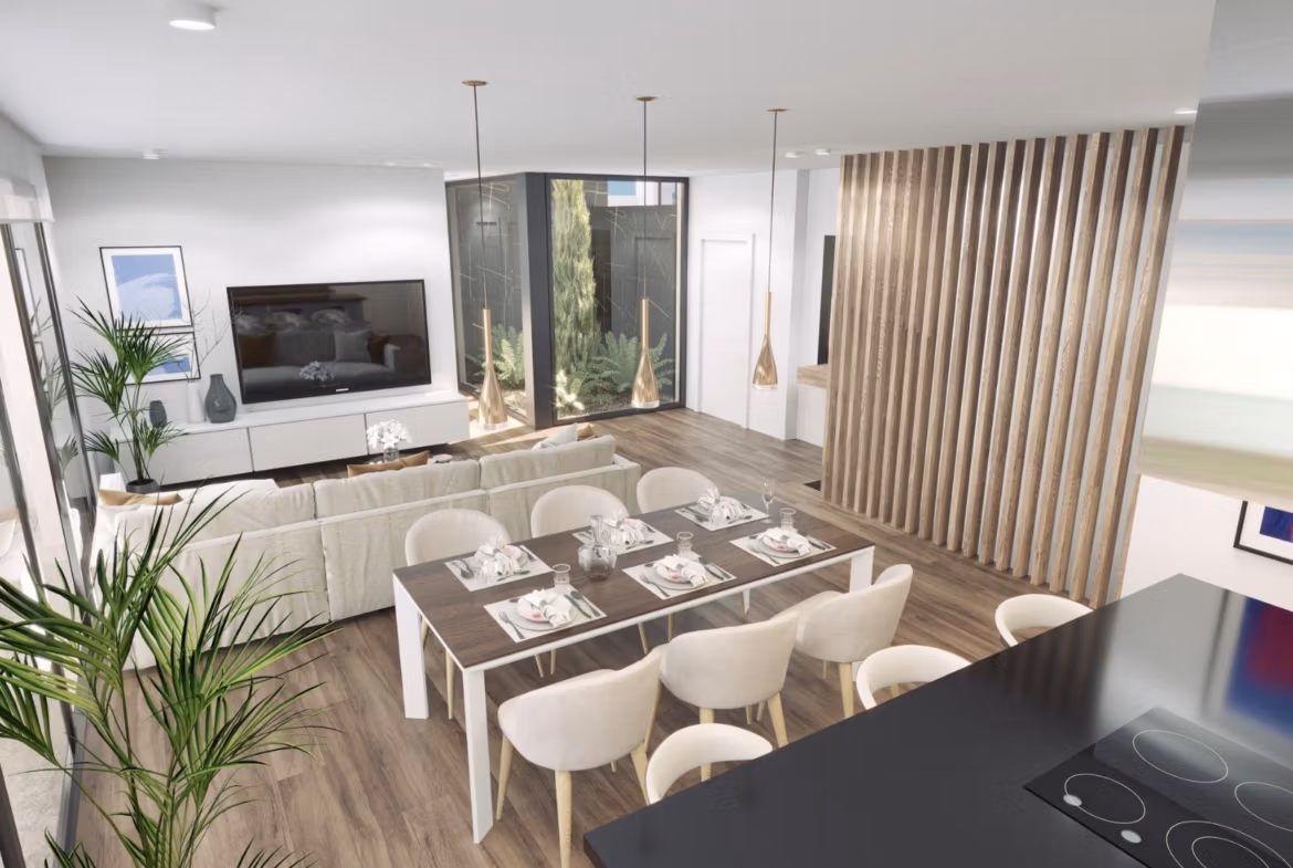 Bright open-plan living and dining area in modern 3-bedroom villa in Finestrat with sleek design and large windows.