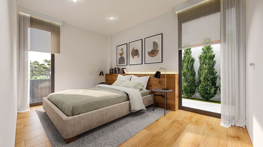 Bright and modern bedroom with large windows and garden views in a 3-bedroom villa for sale in Sierra Cortina, Finestrat