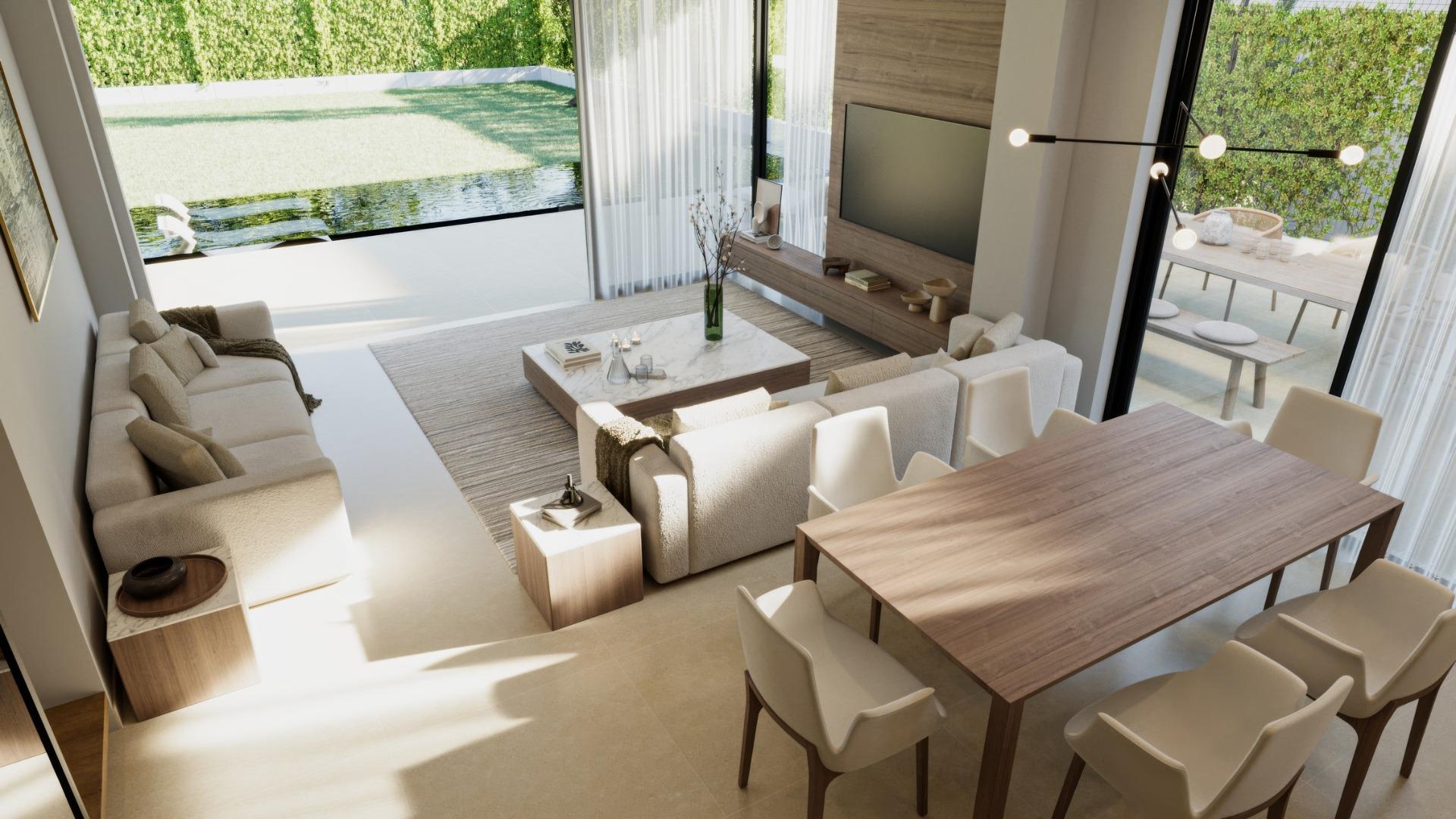 Sunlit open-plan living and dining area with modern furnishings in a luxury 3-bedroom villa in Sierra Cortina, Finestrat.