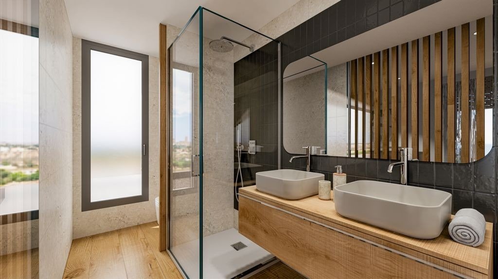 Modern, elegant bathroom with double sinks and walk-in shower in a 3-bedroom villa in Sierra Cortina, Finestrat.