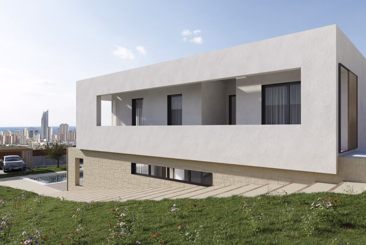 NEW-BUILD-VILLAS-IN-FINESTRAT-7 Modern contemporary villa exterior with large terrace, panoramic sea views, and lush landscaped garden in Finestrat, Benidorm.