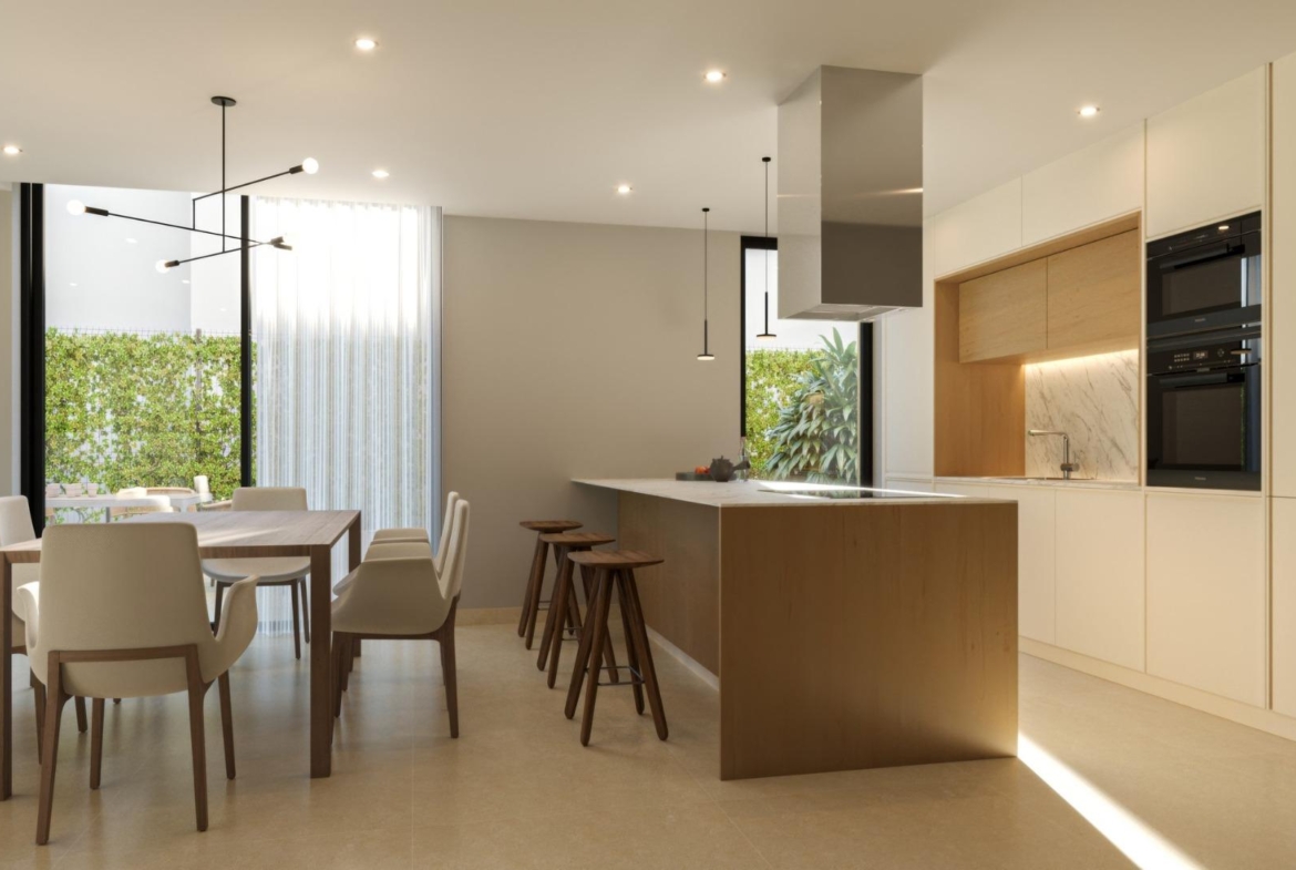Bright modern kitchen and dining area with sleek wood accents in exclusive 3 bedroom villa, Sierra Cortina, Finestrat