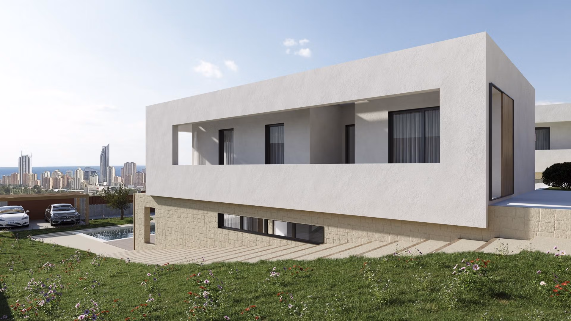 NEW-BUILD-VILLAS-IN-FINESTRAT-7 Modern contemporary villa exterior with large terrace, panoramic sea views, and lush landscaped garden in Finestrat, Benidorm.