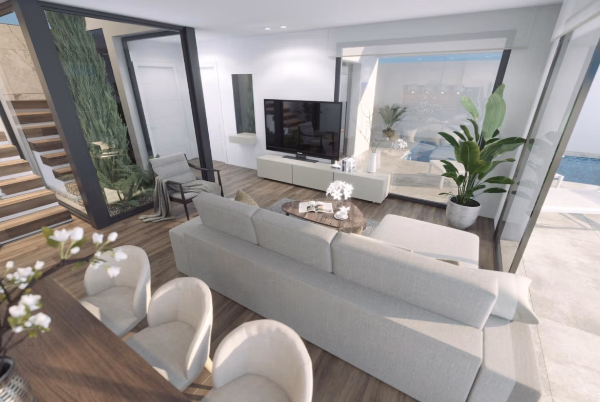 Bright, modern living room with elegant open-plan dining area and sliding doors opening to private pool in new 3-bedroom villa, Finestrat sea views.