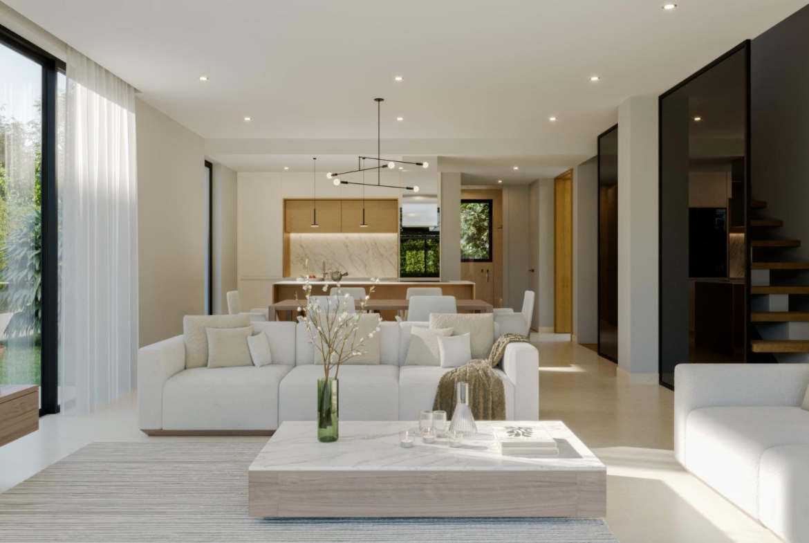 Sun-drenched open-plan living and dining area in a modern 3-bedroom villa at Sierra Cortina, Finestrat.
