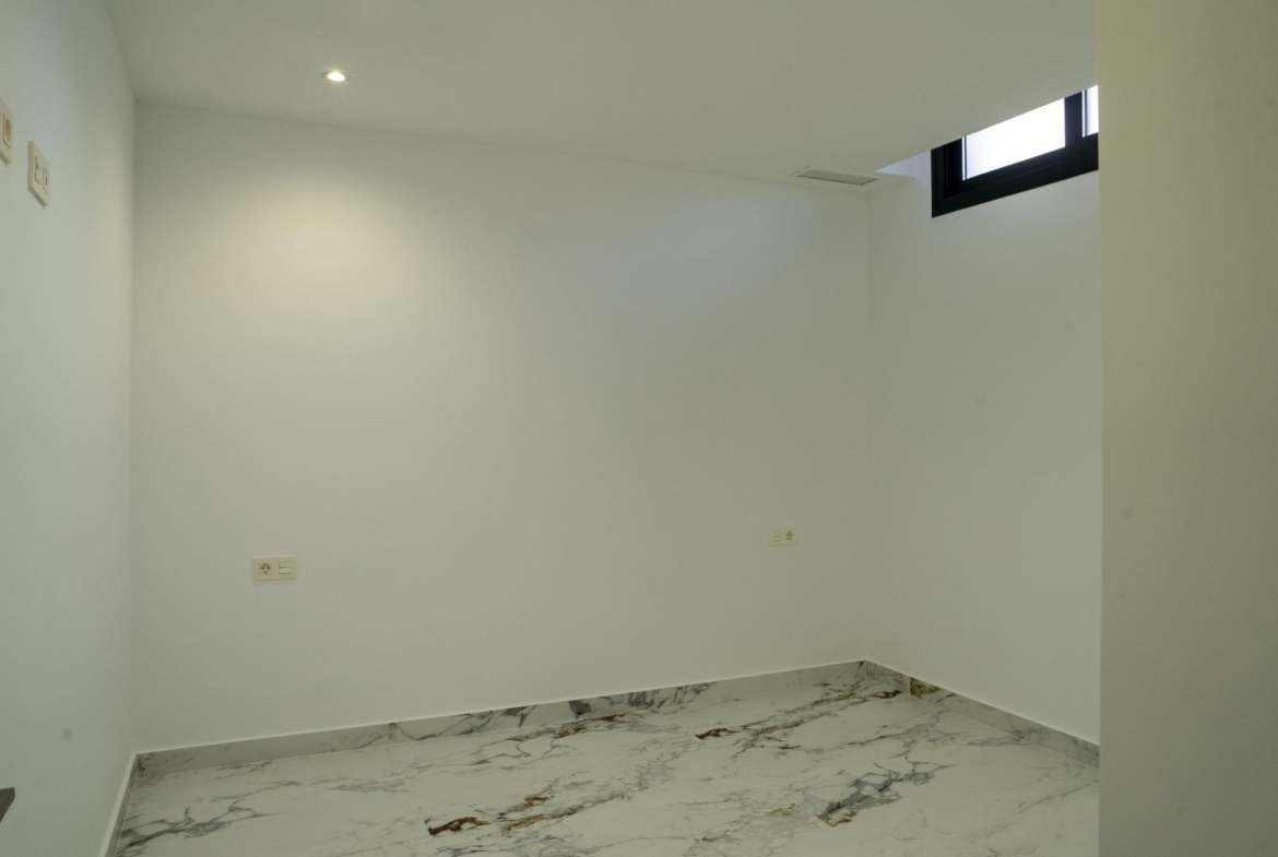 Bright, modern bedroom with marble-effect flooring in a new build 3 bedroom villa in La Nucia, Costa Blanca