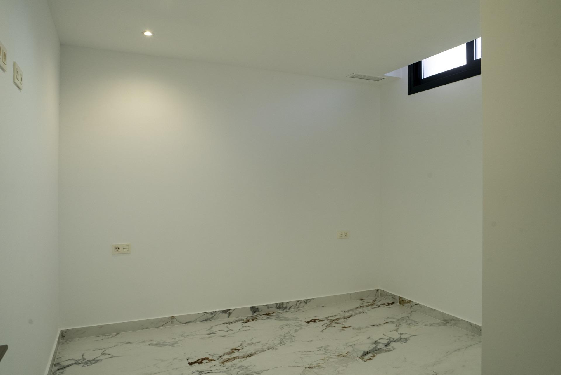 Bright, modern bedroom with marble-effect flooring in a new build 3 bedroom villa in La Nucia, Costa Blanca