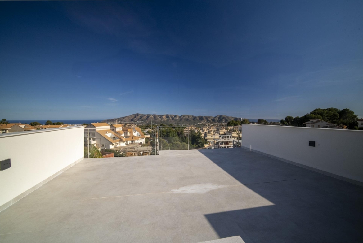 Spacious sun-drenched terrace of modern 3 bedroom villa in La Nucia, Costa Blanca with panoramic mountain and sea views