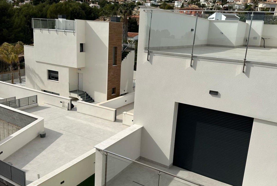 Bright modern new build 3 bedroom villa with sleek terraces and mountain views in La Nucia, Costa Blanca.