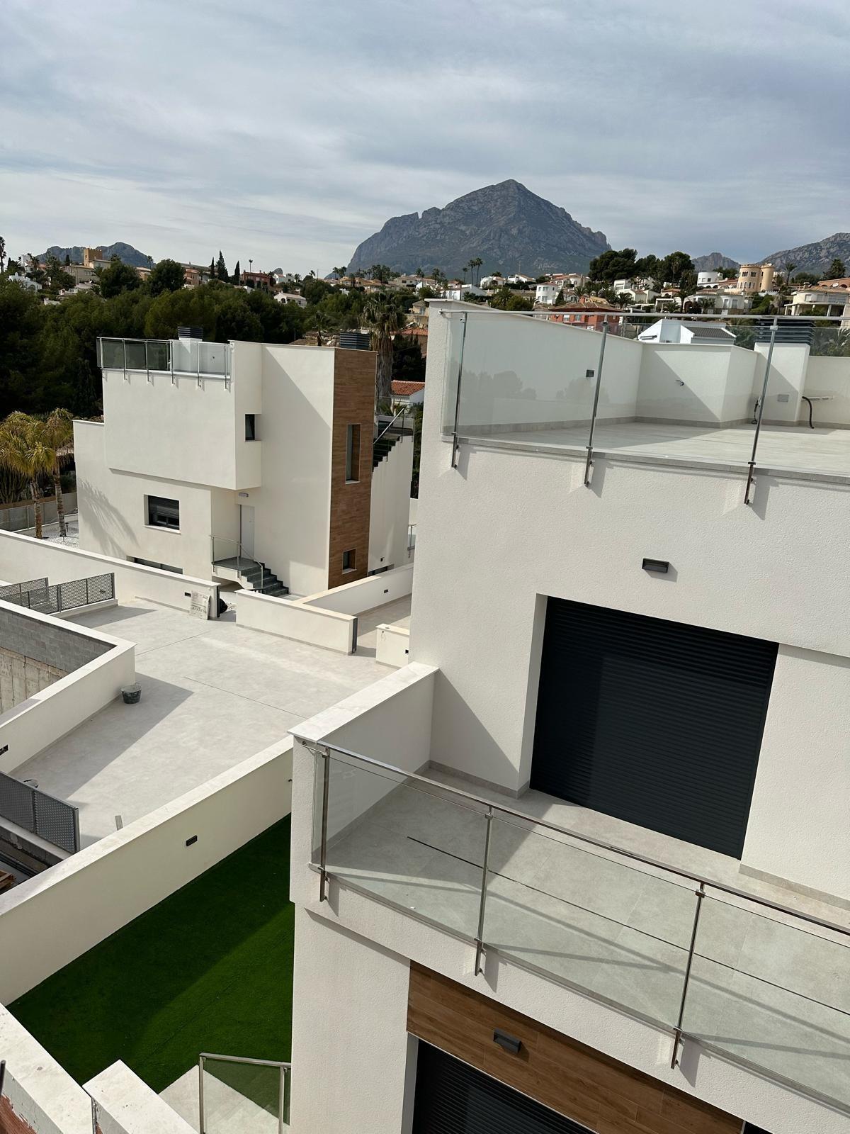 Bright modern new build 3 bedroom villa with sleek terraces and mountain views in La Nucia, Costa Blanca.