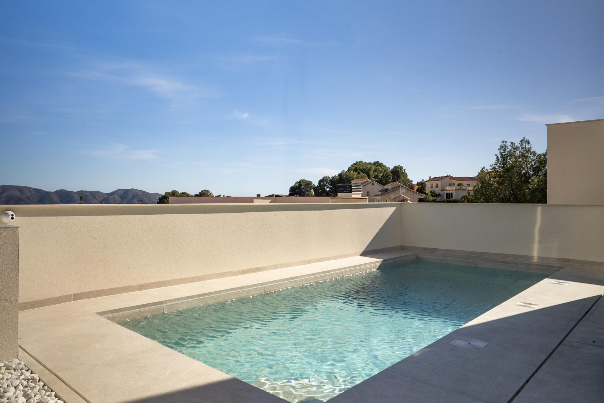 Private sun-drenched pool with clear water at modern new build 3-bedroom villa in La Nucia, Costa Blanca
