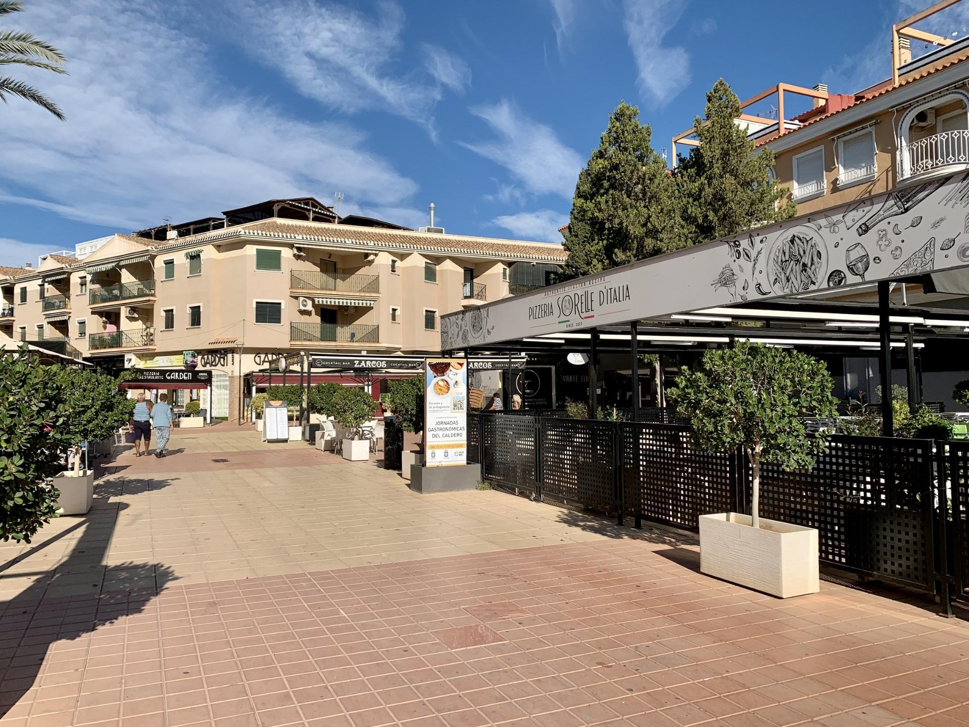 Sunlit vibrant terrace and dining area near exclusive new build villas with private pools in Los Alcázares, Murcia.