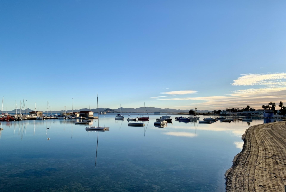 Tranquil waterfront view near exclusive new build villas with private pools, just 150m from the beach in Los Alcázares, Murcia.