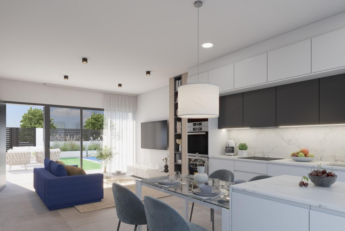 Bright modern open-plan kitchen and living area with sleek design in exclusive Los Alcázares villa near the beach.