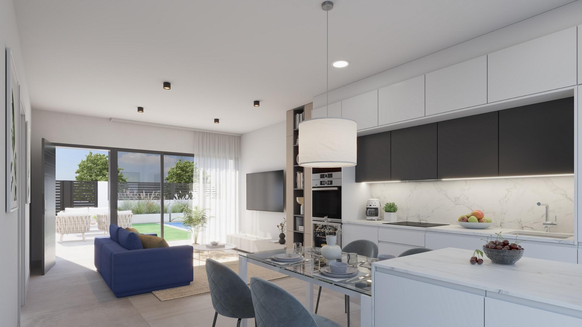 Bright modern open-plan kitchen and living area with sleek design in exclusive Los Alcázares villa near the beach.