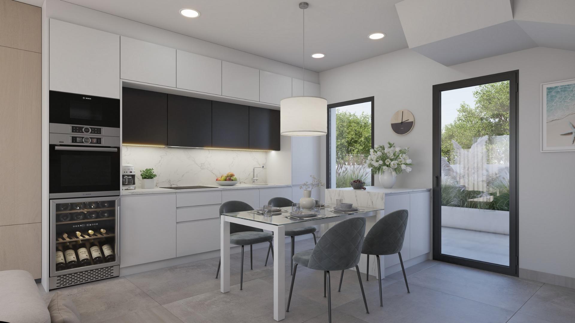 Bright modern kitchen and dining area in exclusive new build villa with garden access near Los Alcázares beach, Murcia