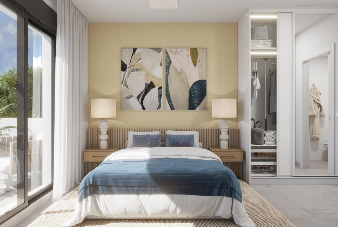 Bright, elegant bedroom with modern decor and garden views in exclusive new build villa near the beach in Los Alcázares, Murcia.