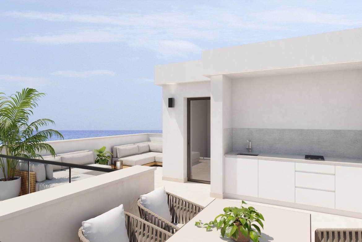 Bright terrace with modern outdoor kitchen and seating, exclusive new build villa just steps from the beach in Los Alcázares, Murcia