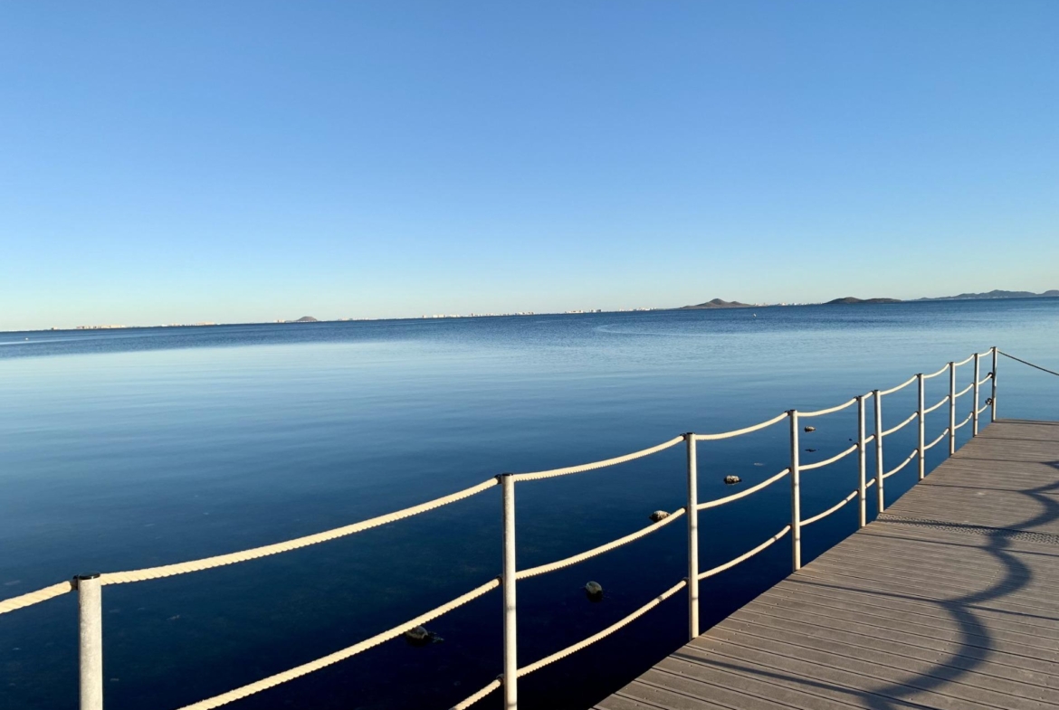 Serene panoramic sea view from a sunlit terrace of exclusive new build villas near the beach in Los Alcázares, Murcia.