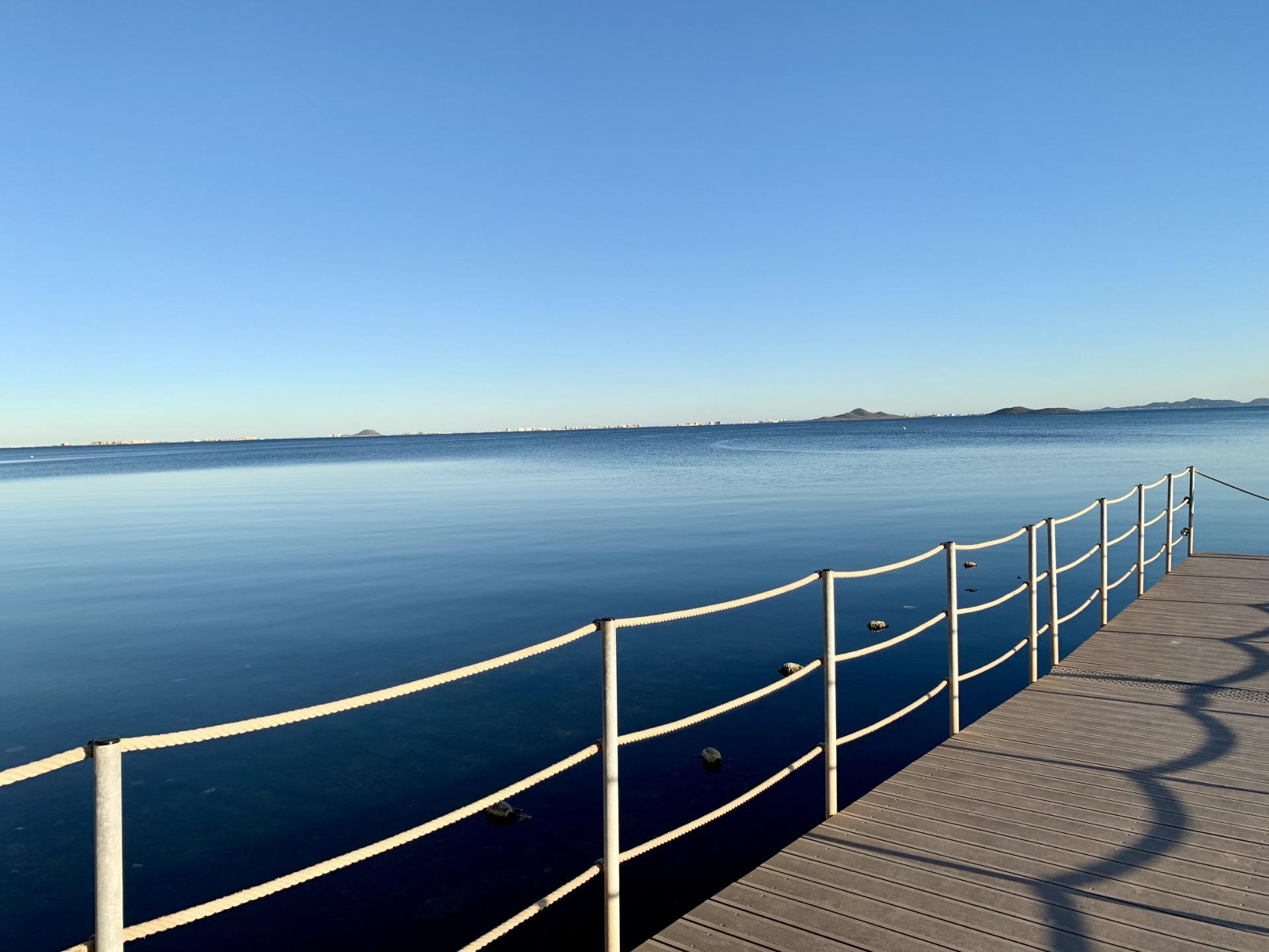 Serene panoramic sea view from a sunlit terrace of exclusive new build villas near the beach in Los Alcázares, Murcia.