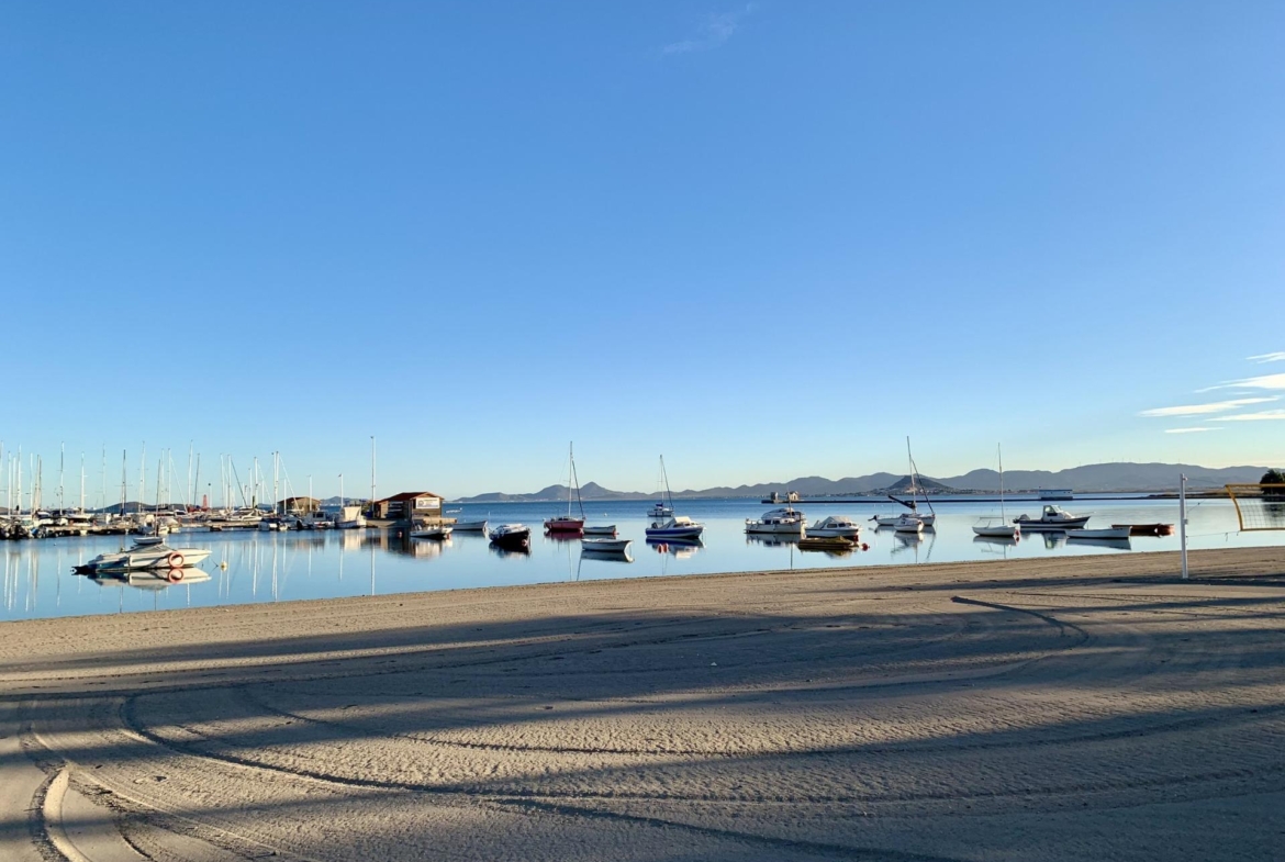 Tranquil marina with sleek boats and calm waters near exclusive new build villas at Los Alcázares beach, Murcia.
