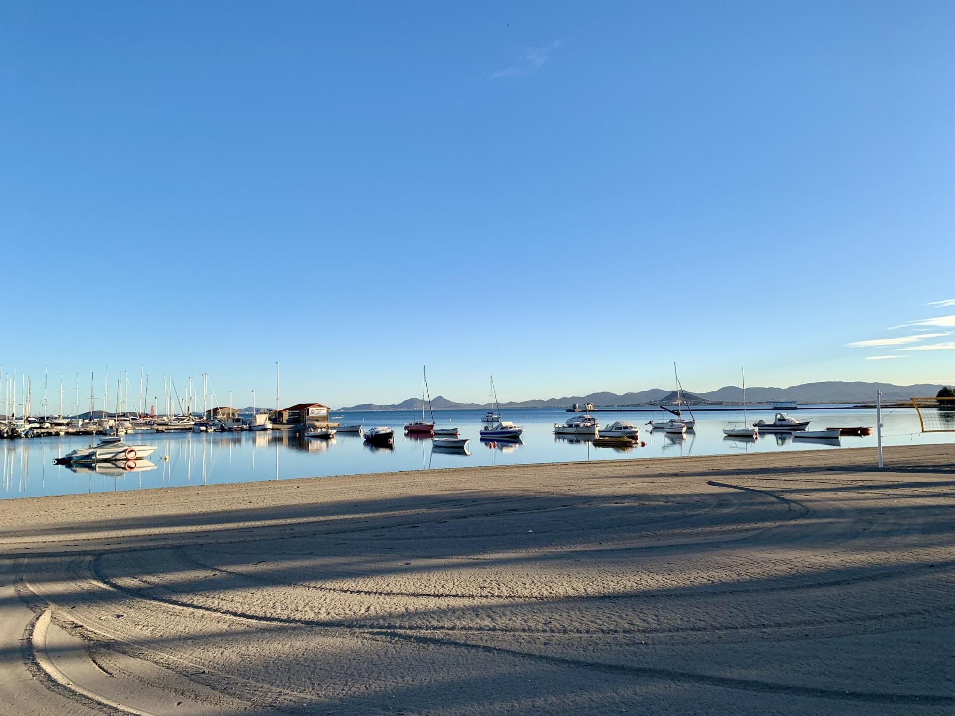 Tranquil marina with sleek boats and calm waters near exclusive new build villas at Los Alcázares beach, Murcia.