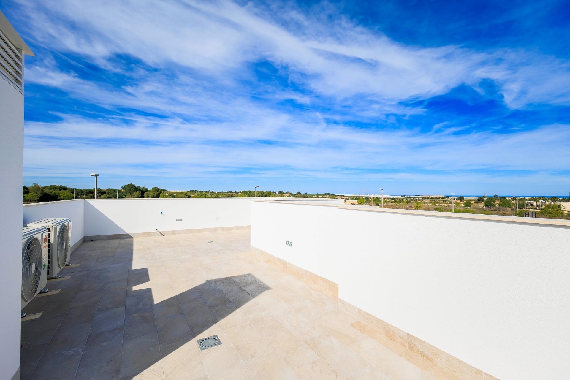 NEW-BUILD-VILLAS-IN-PILAR-DE-LA-HORADADA-ON-THE-GOLF-COURSE-30 Sun-drenched spacious terrace with panoramic golf course views, part of new build villas in Pilar de la Horadada