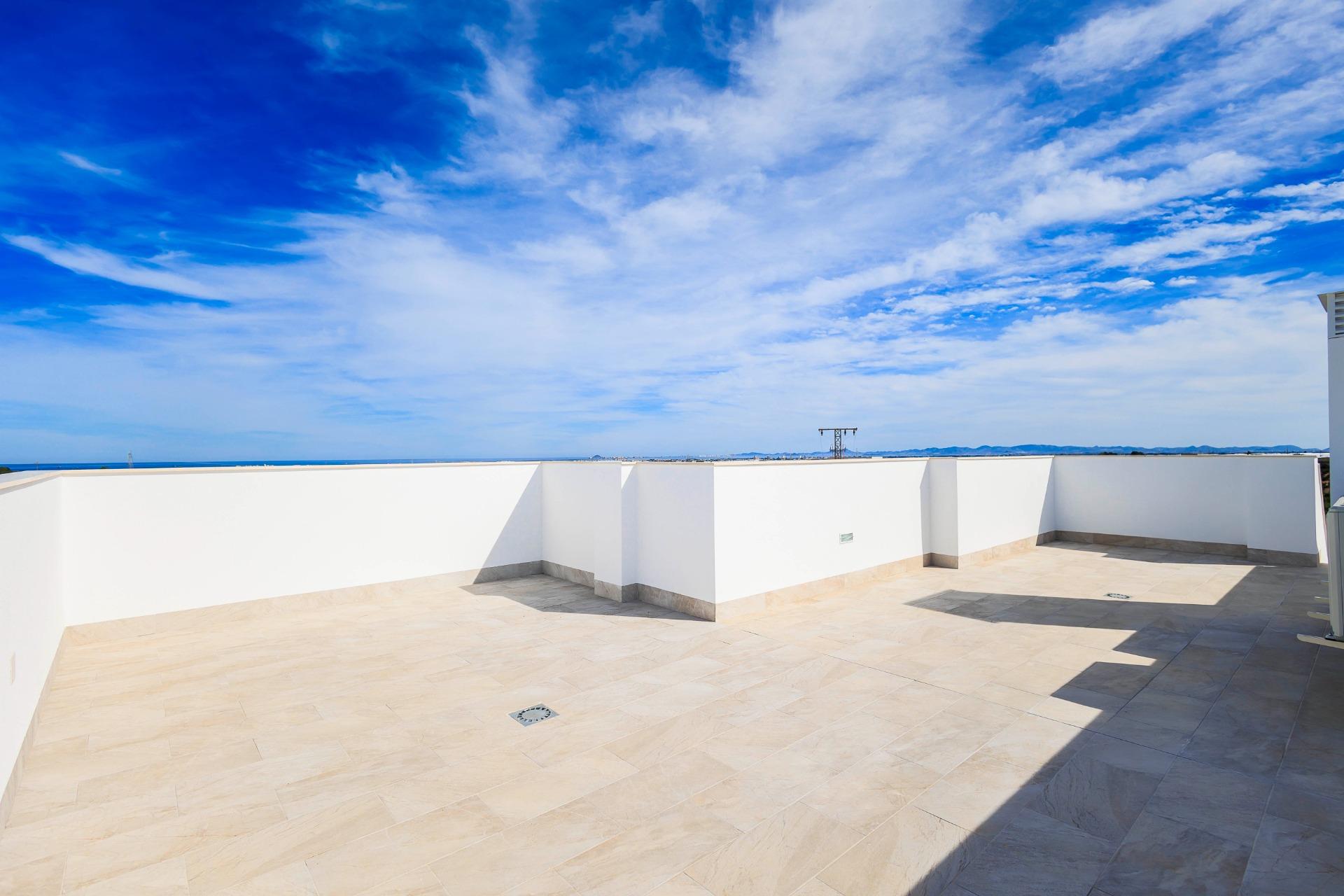 Spacious sun-drenched terrace with panoramic sky views in new build villas in Pilar de la Horadada on the golf course