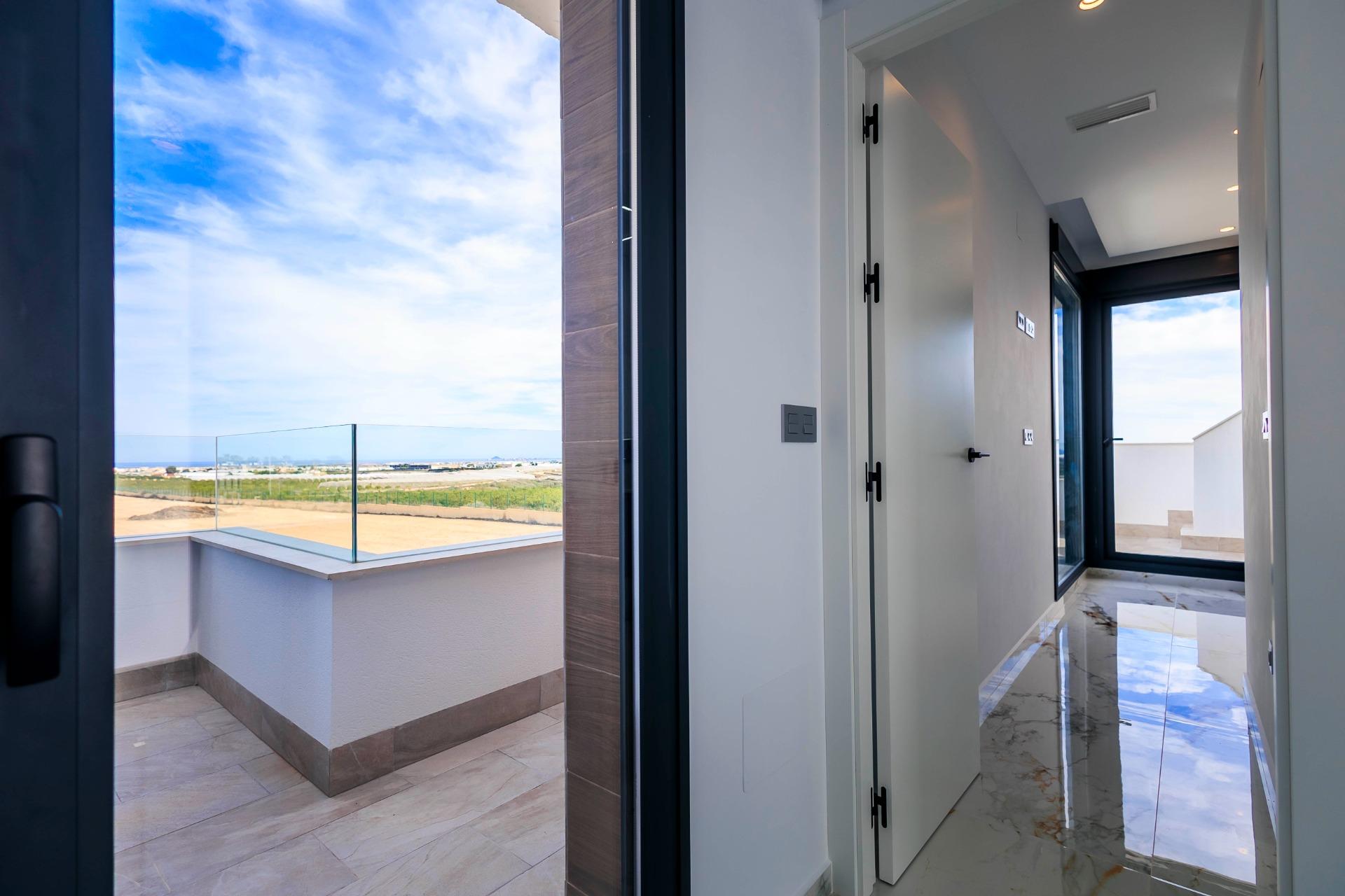Bright modern hallway and sun-drenched terrace in new build villas overlooking the golf course in Pilar de la Horadada
