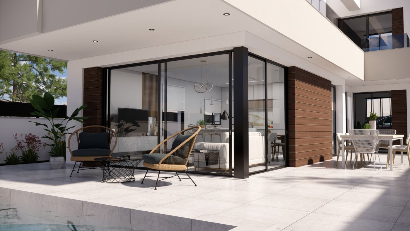NEW-BUILD-VILLAS-IN-PILAR-DE-LA-HORADADA-ON-THE-GOLF-COURSE-5 Modern, sun-drenched terrace with stylish seating at new build villas in Pilar de la Horadada golf course.