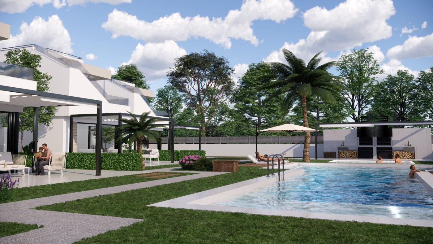 Modern new build villas in Pilar de la Horadada featuring a spacious sunlit pool area surrounded by lush landscaping and palm trees.