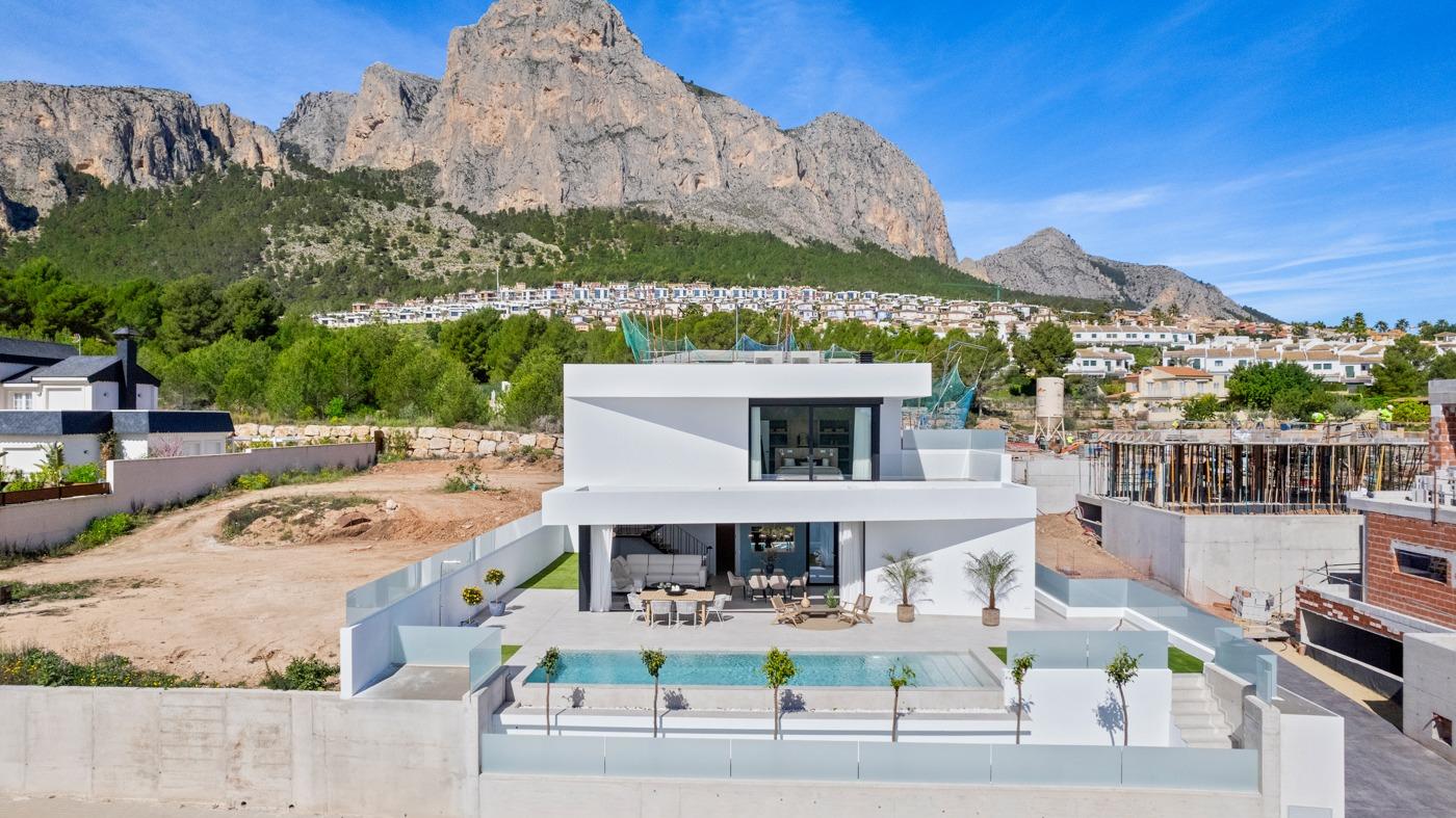 Stunning modern 3-bedroom villa with private pool and spacious terrace set against dramatic mountain backdrop in Polop, Costa Blanca.
