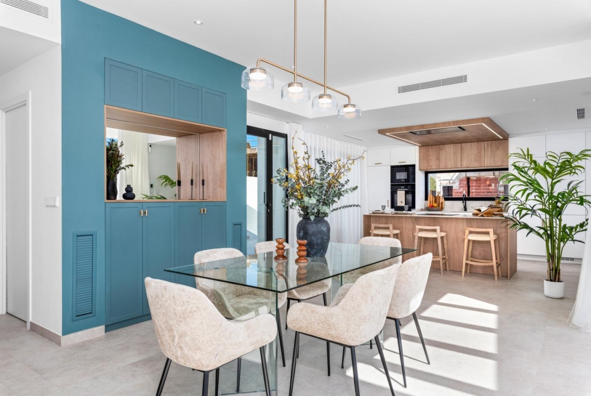Bright open-plan dining area with modern kitchen and elegant decor in new 3 bedroom villa, Polop, Costa Blanca