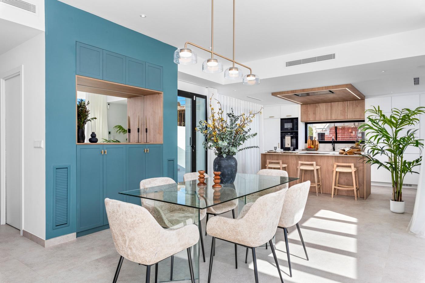 Bright open-plan dining area with modern kitchen and elegant decor in new 3 bedroom villa, Polop, Costa Blanca