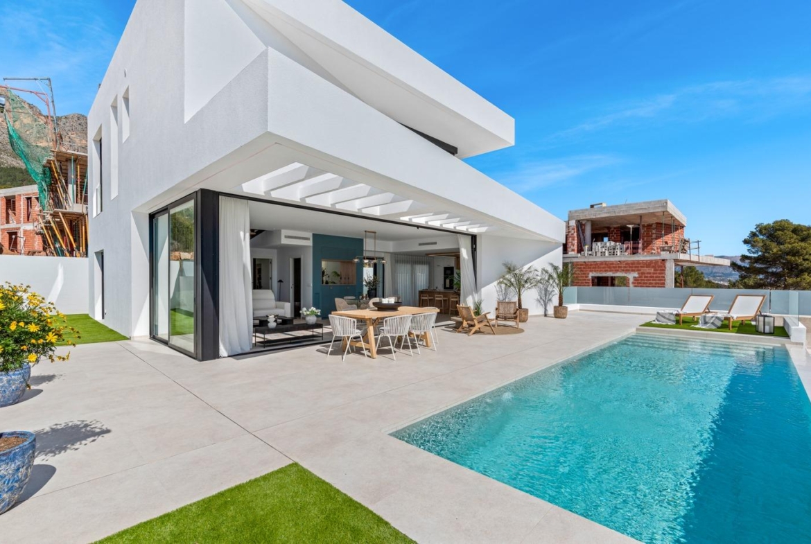 Modern 3 bedroom villa in Polop, Costa Blanca with sun-drenched terrace, sleek open-plan living, and private sparkling pool.