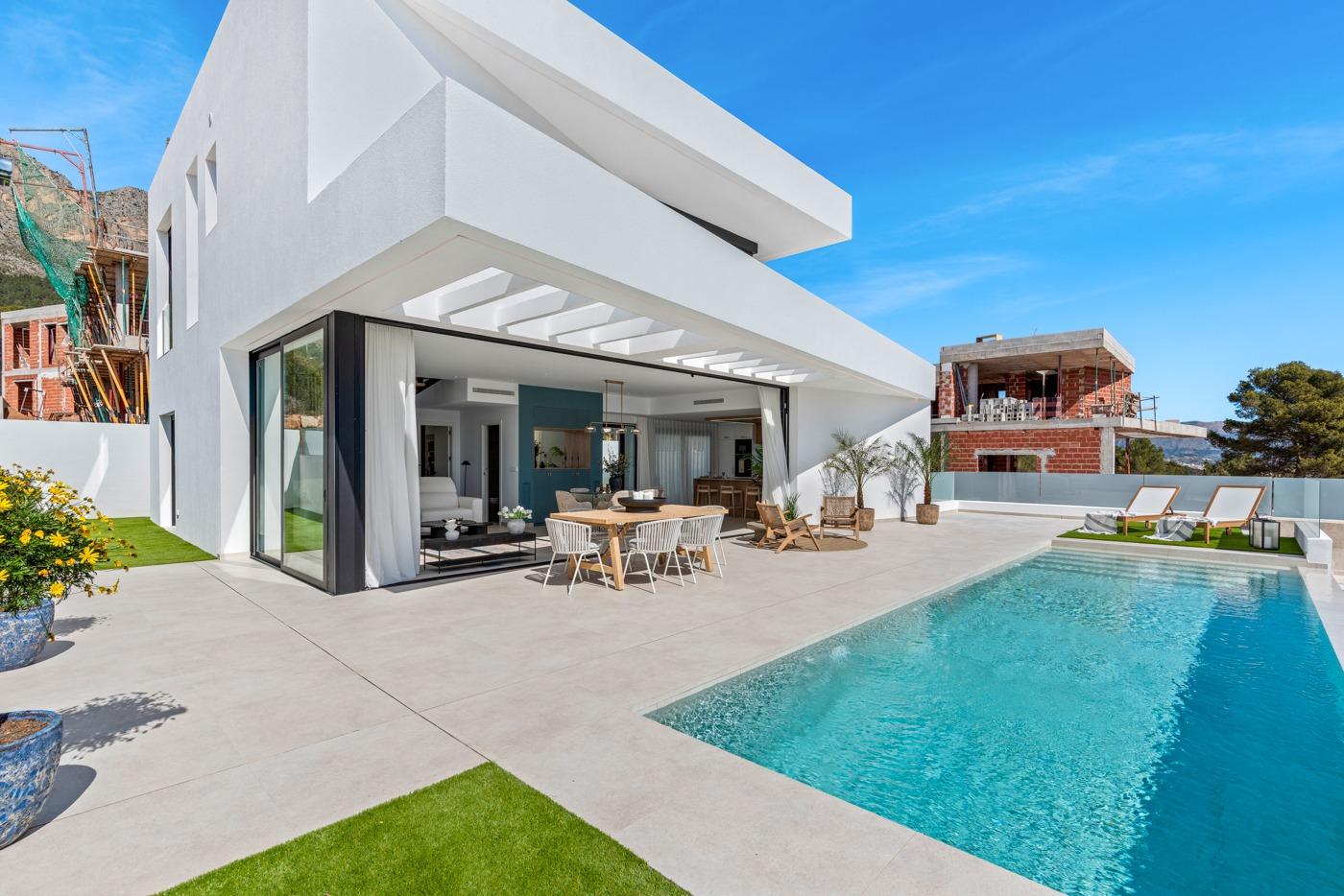 Modern 3 bedroom villa in Polop, Costa Blanca with sun-drenched terrace, sleek open-plan living, and private sparkling pool.